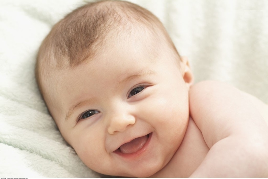 baby smiling responsively early