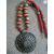 Red and golden necklace with large pendant