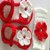 Hand made woolen baby booties in red and white color with a beautiful head band