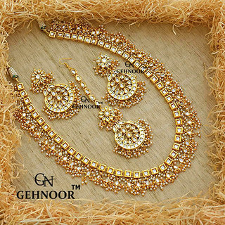 Buy Gehnoor High Quality Artificial Single Layer Kundan Pearl Long Rani Haar Necklace Chandbali Earrings Maangtika Online 4399 From Shopclues Rani haar kundan necklace set which is 34 inches in length and ear rings 2 inches in length.the pendant is 2 inches in length and width , stringed with pearl and kundan stones. gehnoor high quality artificial single layer kundan pearl long rani haar necklace chandbali earrings maangtika