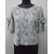 Ladies top in leaf jacquard knit fabric with bow detail at sleeve