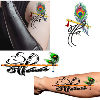 Angel Tattoo Design Studio small peacock feather tattoo with flute made on  wrist