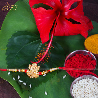                       Vighnaharta Lord Gajanan Gold and Rhodium Plated Alloy Rakhi for Lovely Brother                                              