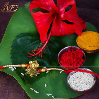                       Vighnaharta  Dholak Ganesh ji Gold and Rhodium Plated Alloy Rakhi for Lovely Brother                                              