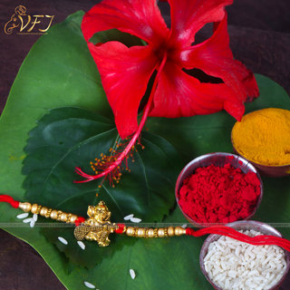                       Vighnaharta Ganesh with Veena Gold and Rhodium Plated Alloy Rakhi for Lovely Brother                                              
