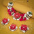 Sukkhi Glossy White & Red Choker Flower Necklace Set for Haldi Ceremony