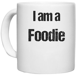                       UDNAG White Ceramic Coffee / Tea Mug 'Foodie | I am a Foodie' Perfect for Gifting [330ml]                                              