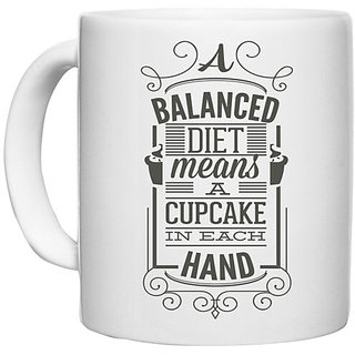                       UDNAG White Ceramic Coffee / Tea Mug 'Diet | A balanced diet means a cupcake in each hand' Perfect for Gifting [330ml]                                              