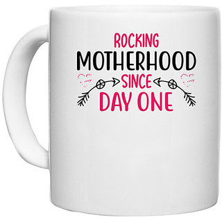                       UDNAG White Ceramic Coffee / Tea Mug 'Mom | ROCKING MOTHERHOOD SINCE DAY ONE' Perfect for Gifting [330ml]                                              