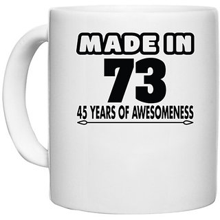                       UDNAG White Ceramic Coffee / Tea Mug 'Awesomeness | made in 73' Perfect for Gifting [330ml]                                              
