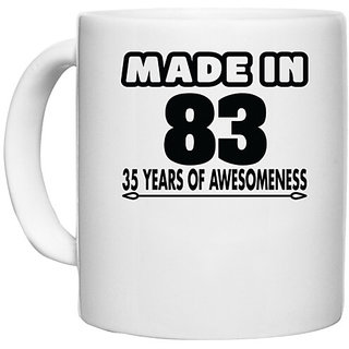                       UDNAG White Ceramic Coffee / Tea Mug 'Awesomeness | made in 83' Perfect for Gifting [330ml]                                              