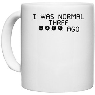                       UDNAG White Ceramic Coffee / Tea Mug 'Cat | i was normal three' Perfect for Gifting [330ml]                                              