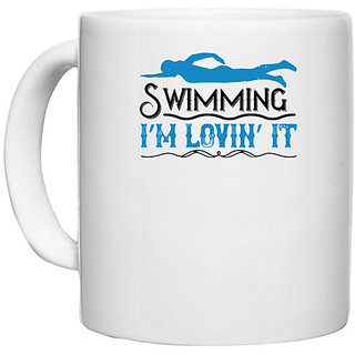                       UDNAG White Ceramic Coffee / Tea Mug 'Swimming | swimming Im lovin it' Perfect for Gifting [330ml]                                              