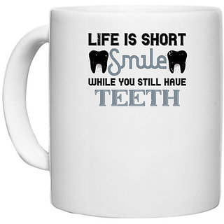                       UDNAG White Ceramic Coffee / Tea Mug 'Dentist | Life is short smile while you still' Perfect for Gifting [330ml]                                              