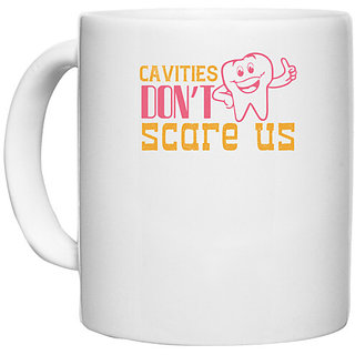                       UDNAG White Ceramic Coffee / Tea Mug 'Dentist | Cavities dont scare us!' Perfect for Gifting [330ml]                                              