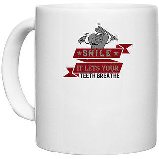                       UDNAG White Ceramic Coffee / Tea Mug 'Dentist | Smile, it lets your teeth breathe' Perfect for Gifting [330ml]                                              