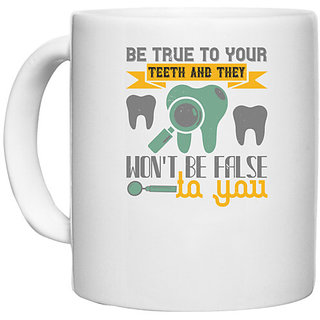                       UDNAG White Ceramic Coffee / Tea Mug 'Dentist | Be true to your teeth and they' Perfect for Gifting [330ml]                                              