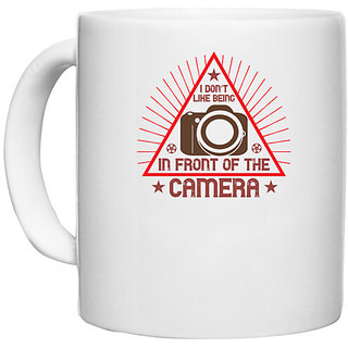                       UDNAG White Ceramic Coffee / Tea Mug 'Cameraman | I don't LIKE BEING' Perfect for Gifting [330ml]                                              