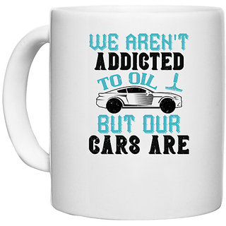                       UDNAG White Ceramic Coffee / Tea Mug 'Car | We aren't addicted to oil, but our cars are' Perfect for Gifting [330ml]                                              