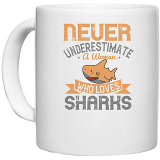                      UDNAG White Ceramic Coffee / Tea Mug 'Shark | Never underestimate a woman who loves sharks' Perfect for Gifting [330ml]                                              