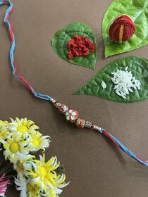 Beautiful Designer Rakhi Meenakari Red Kundan Bead With Multicolor Thread Rakhi For Raksha Bandhan