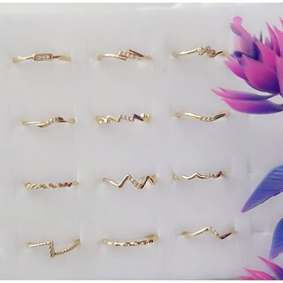 Trendy light weight gold plated Finger Rings for women (Combo set of 12) Trendy light weight gold plated Finger Rings for women (Combo set of 12)
