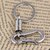 OMCY Stylish Huk Silver Keychain set of 1